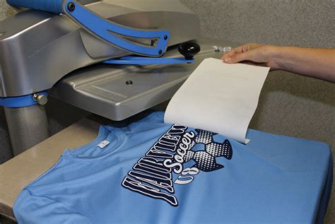 Removing transfer paper from a a T-shirt after printing