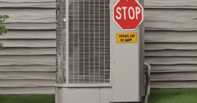 A hvac unit with a stop sign in front of a house.